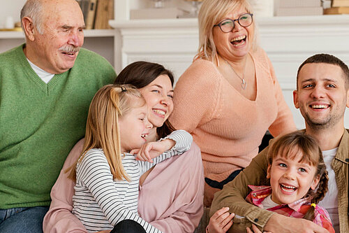 Family A smiling family with grandparents, parents and children